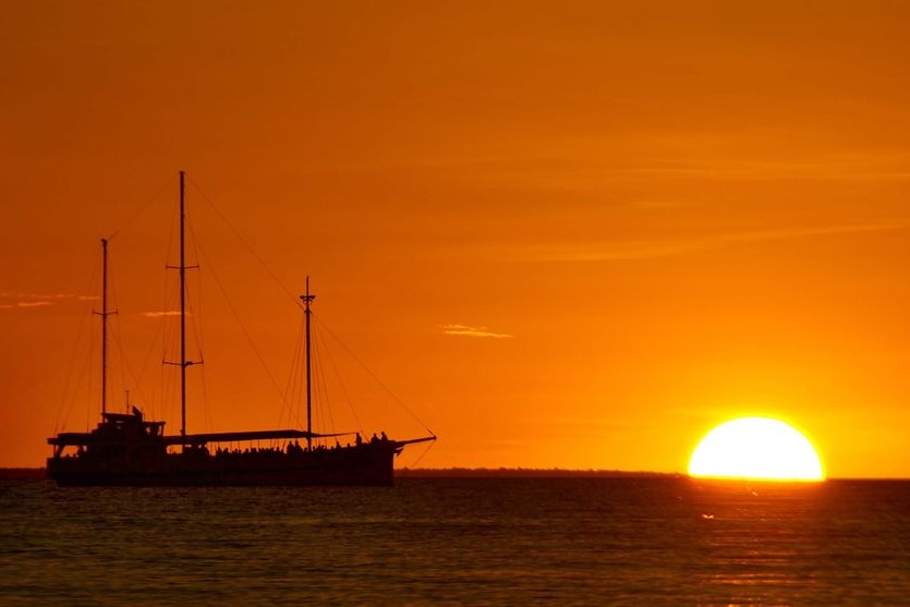 A ship sits off Mindil Beach, Darwin, at sunset