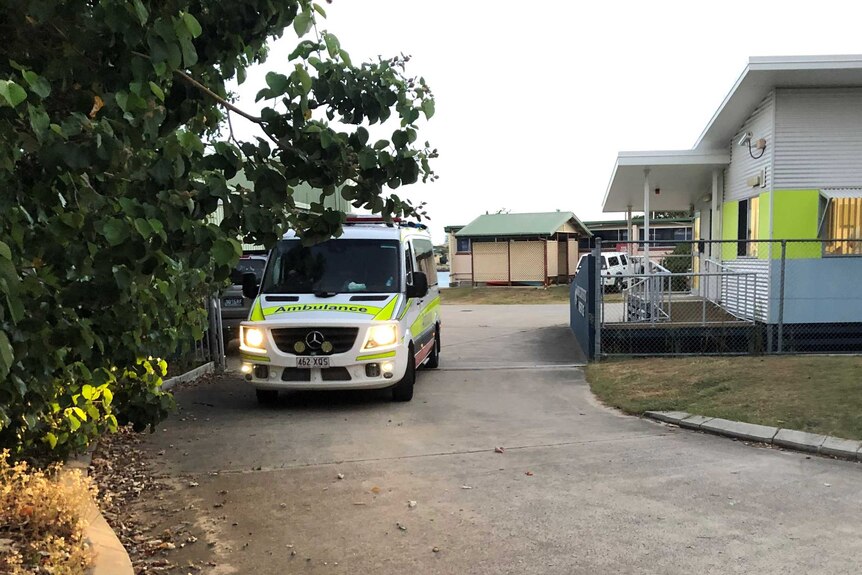 An ambulance drives away from the water police headquarters in Mooloolaba.