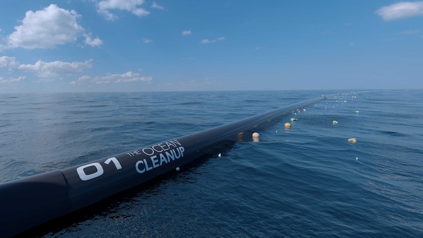 A large pipe floating on the open ocean.