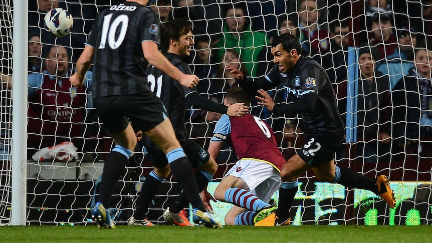 Eventual winner ... Carlos Tevez celebrates after scoring against Aston Villa.