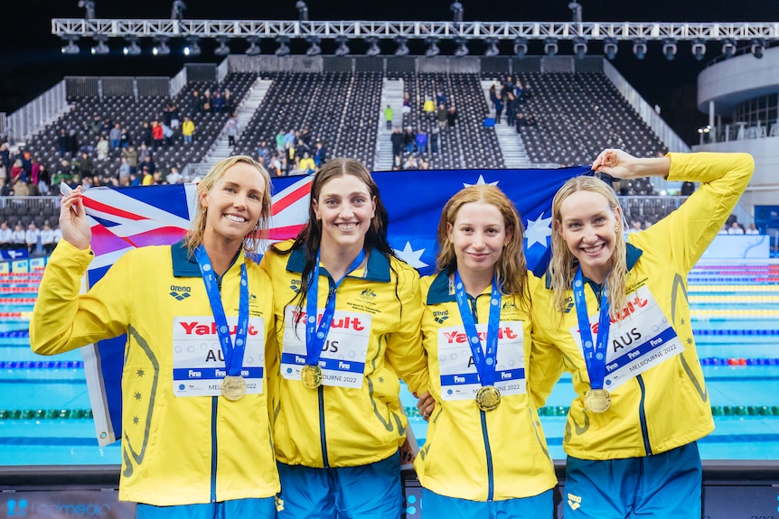 A group of women in yellow with an Australia flag