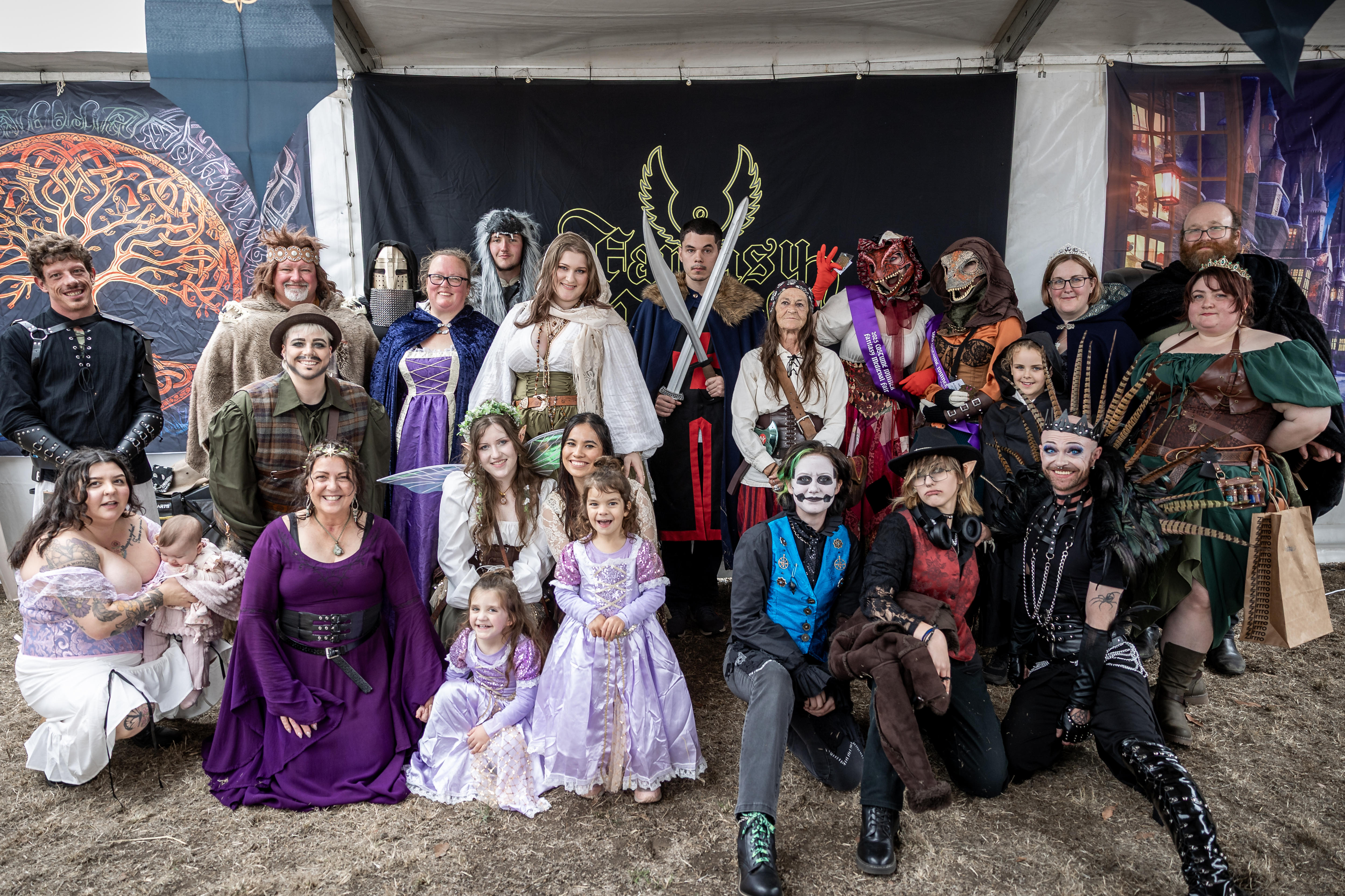 A group of people dressed in colour medieval costumes.