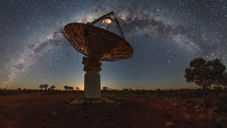 Large telescope at night looking at stars.