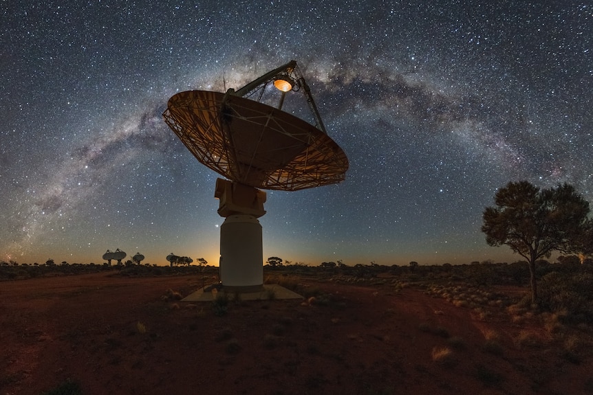large telescope at night looking at stars