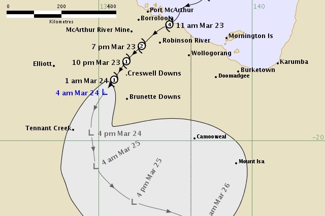 A man showing the tropical low moving through the Top End.