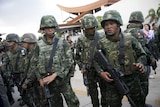 Thai soldiers stand guard after the army chief announced a coup