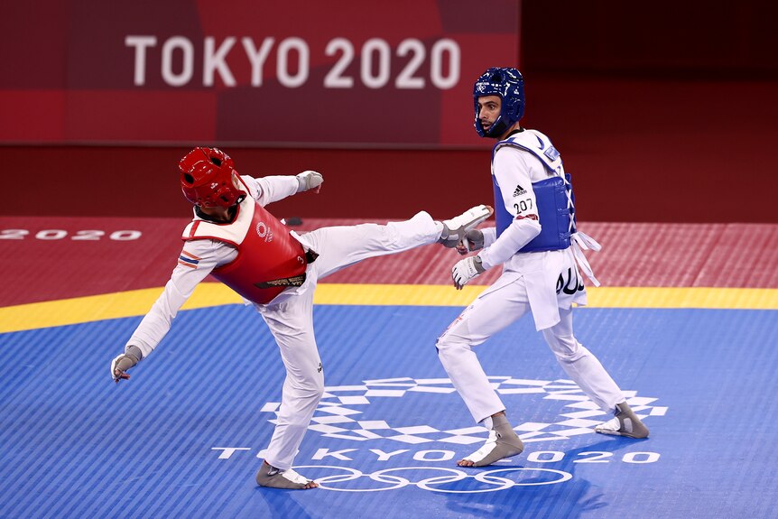 Safwan Khalil (right) competes in Taekwondo at the Tokyo 2020 Olympic Games 