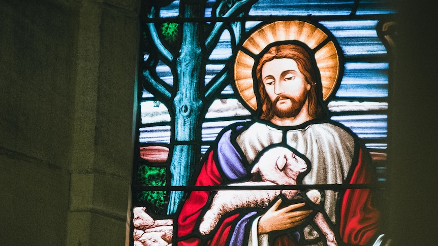 A close up image of stained glass depiction of Jesus