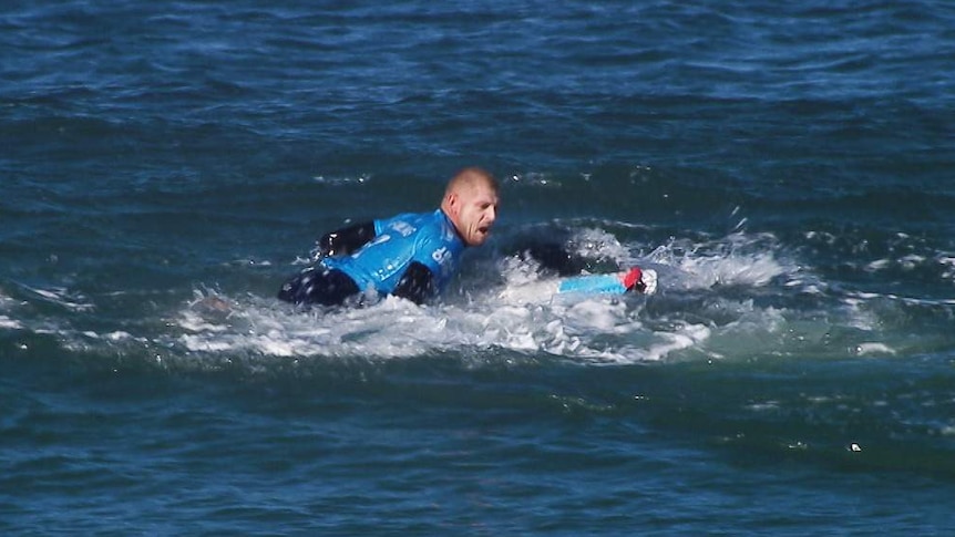 Screengrab of Mick Fanning reacting to shark