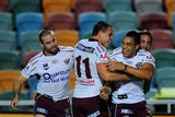 Lucky escape: Dean Whare's (r) three first-half tries gave the Sea Eagles just enough to win.
