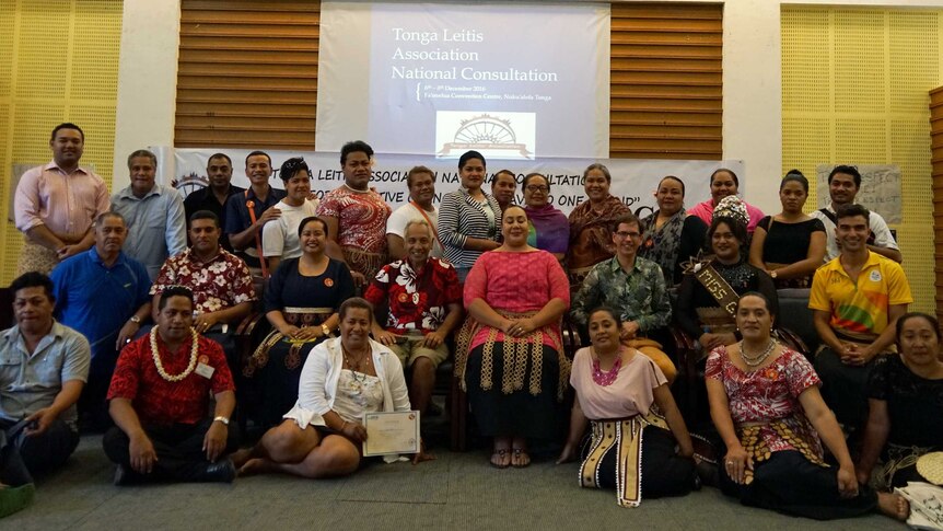 A group of people from the Tonga Leitis Association National Consultation pose for a photo.