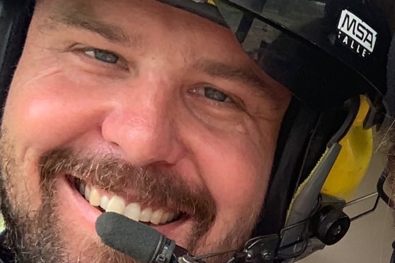 Helicopter pilot Dan Slennett wearing a helmet