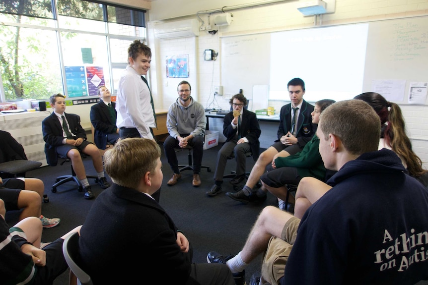 Chris Varney (c) and The Mutants play a game during the mentoring session.