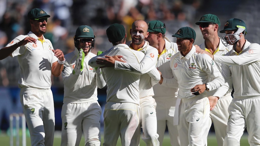 Nathan Lyon celebrates wicket with teammates