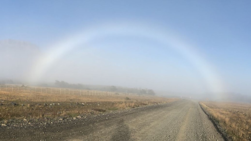 An image of a fog bow. Similar to a rainbow but made of fog the bow appears colourless