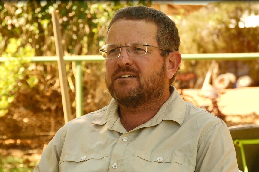 Gary Wyatt close up with greenery in background