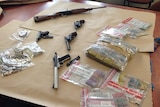 Police display guns cash seized at Launceston airport.