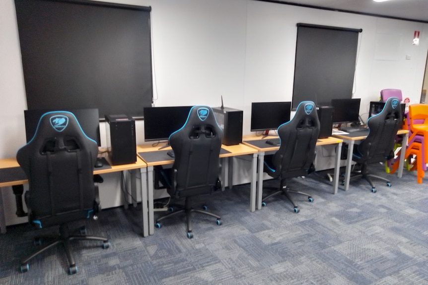 Chairs and screens in computer room of Cairns School of Distance Education 