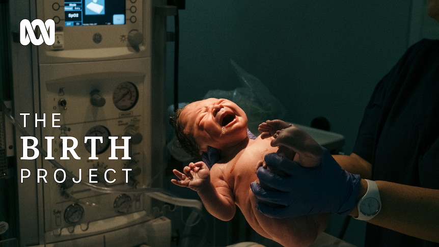 Baby after being born with "The Birth Project" written next to it