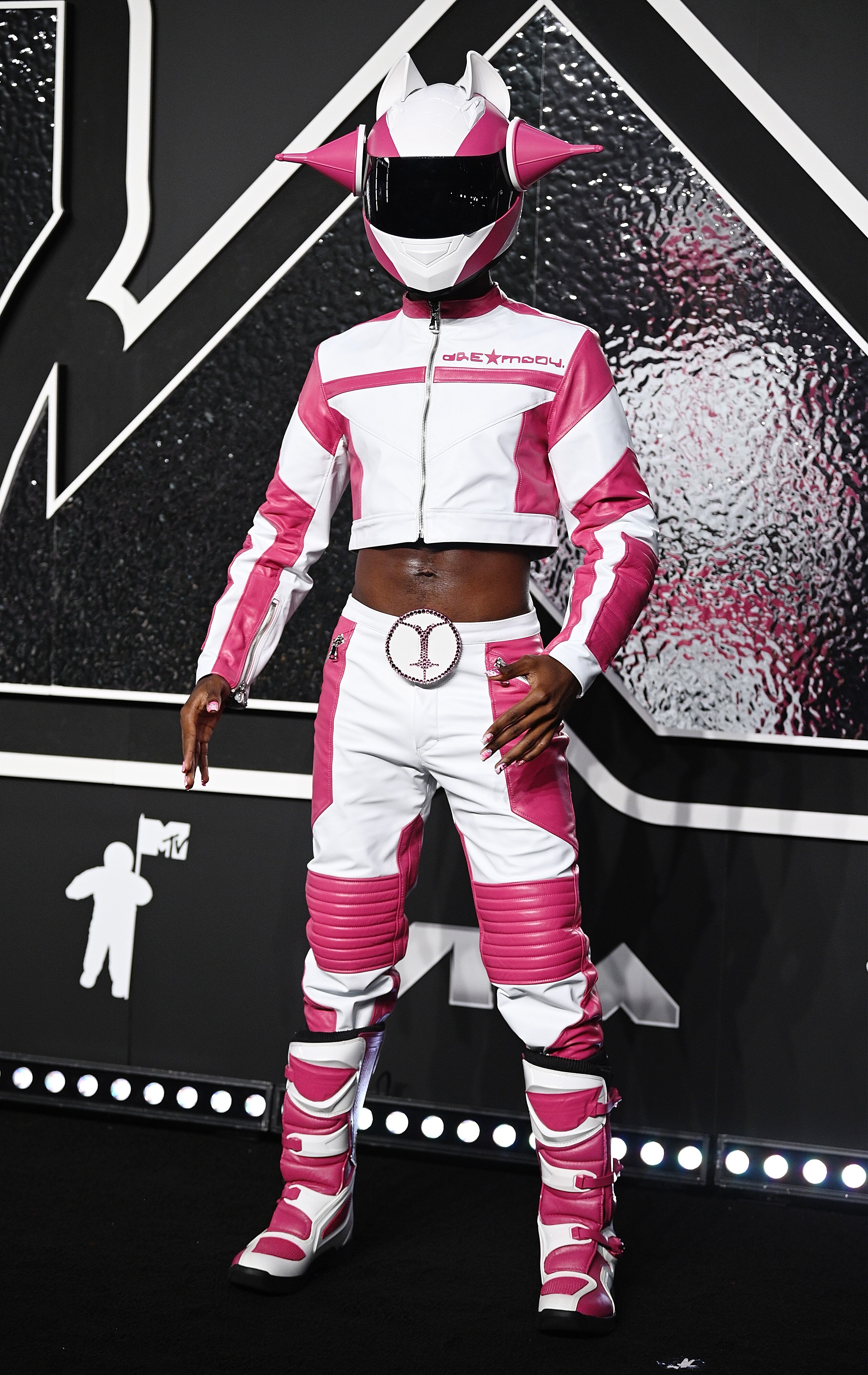 Lil Nas X wearing a pink and white astronaut suit to the VMAs