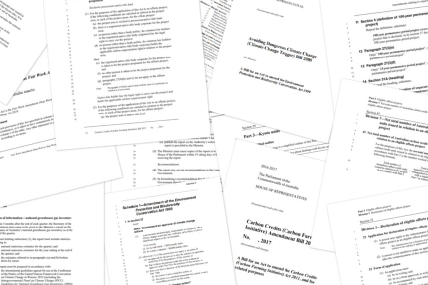 A collage of bills relating to climate change, though slightly blurred to give the text prominence.