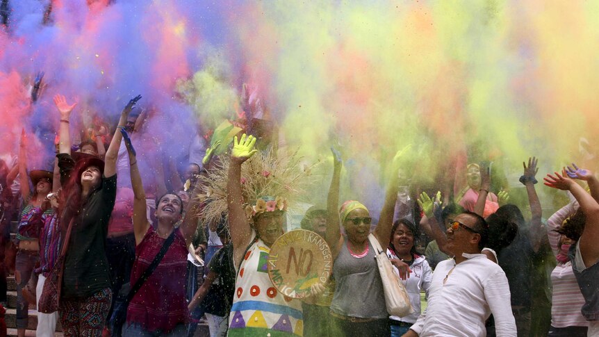 Coloured powders are thrown during a protest in Mexico City