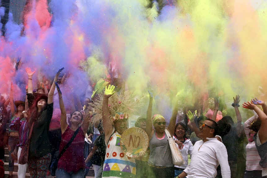 Coloured powders are thrown during a protest in Mexico City