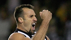 Anthony Rocca kicked eight goals to lead the Pies to victory over Hawthorn.