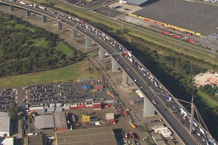 An aerial view of the West Gate Bridge full of traffic.