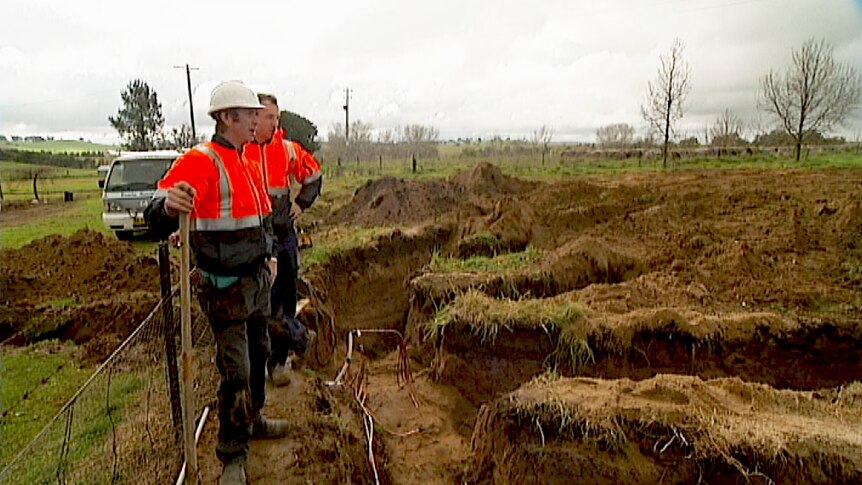 Installers dig trenches for a geothermal energy system on a farm in Boorowa near Canberra.