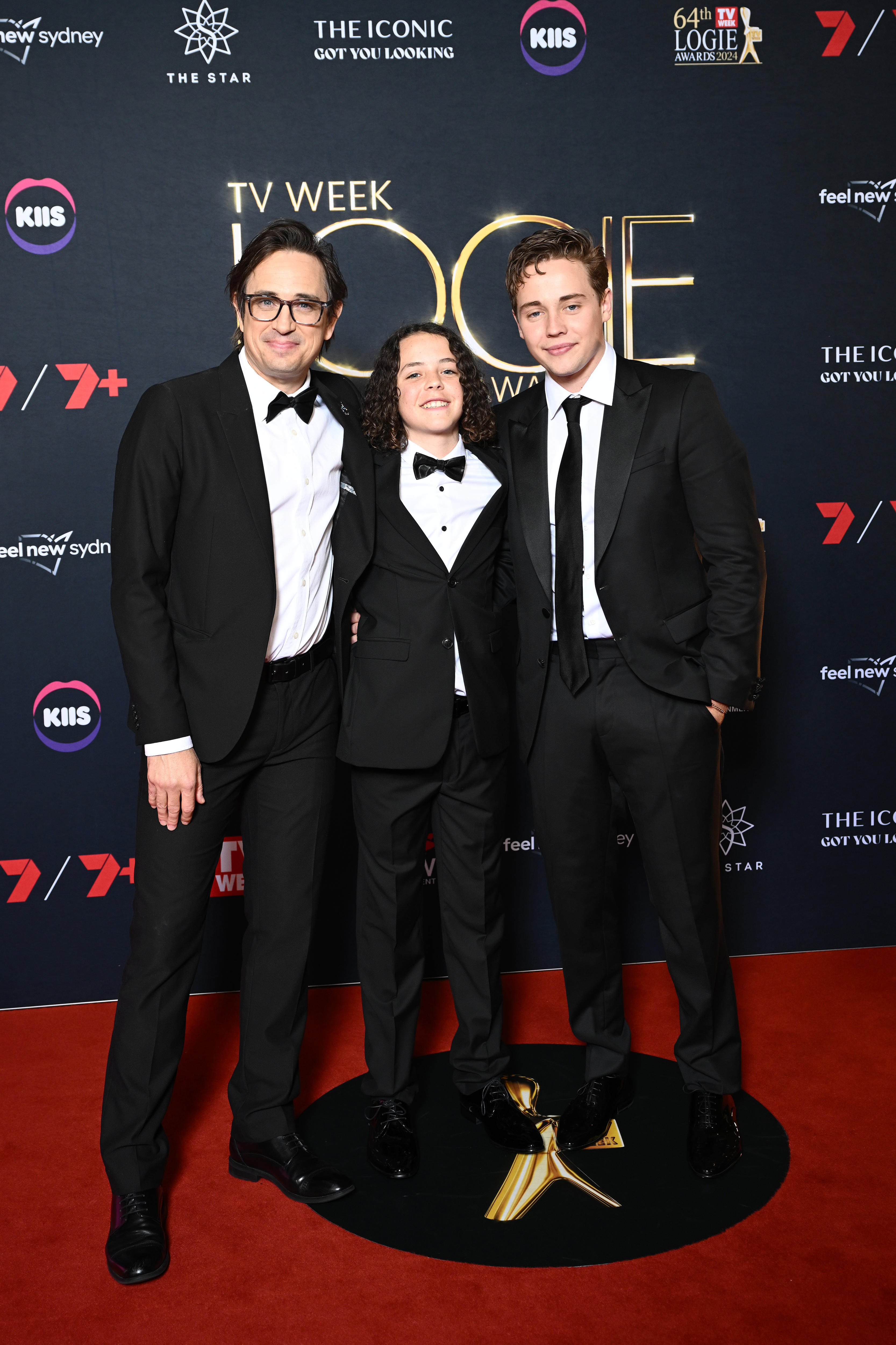  Trent Dalton, Felix Cameron and Lee Halley wear black suits and ties 