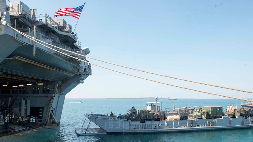 equipment is offloaded on to a US Navy ship near Darwin