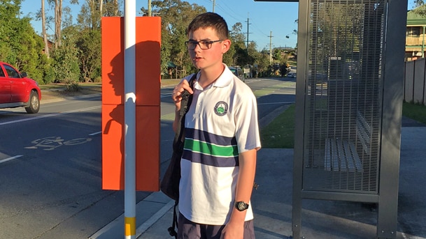 Gold Coast teenager Mitchell Wuth waits at a bus stop