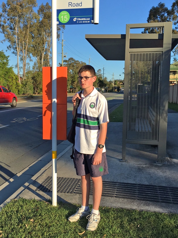 Gold Coast teenager Mitchell Wuth waits at a bus stop