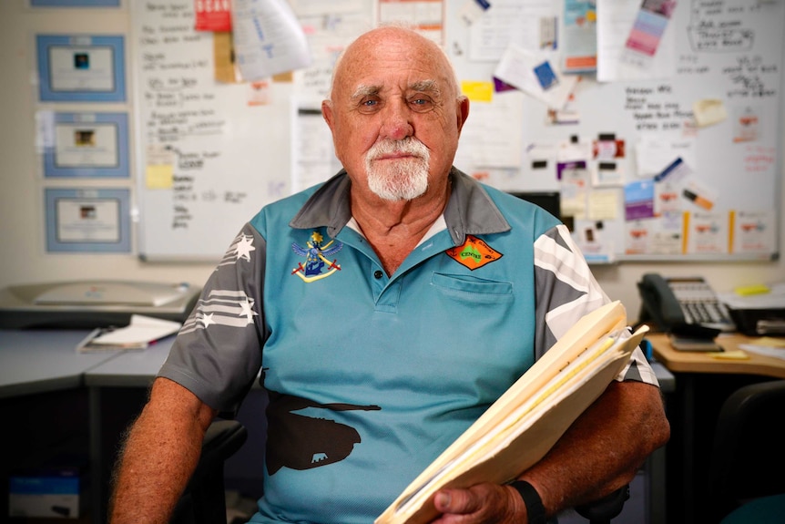Vietnam veteran Chris Mills sits in his office at Townsville's Veterans Support Centre with a handful of files and paperwork.