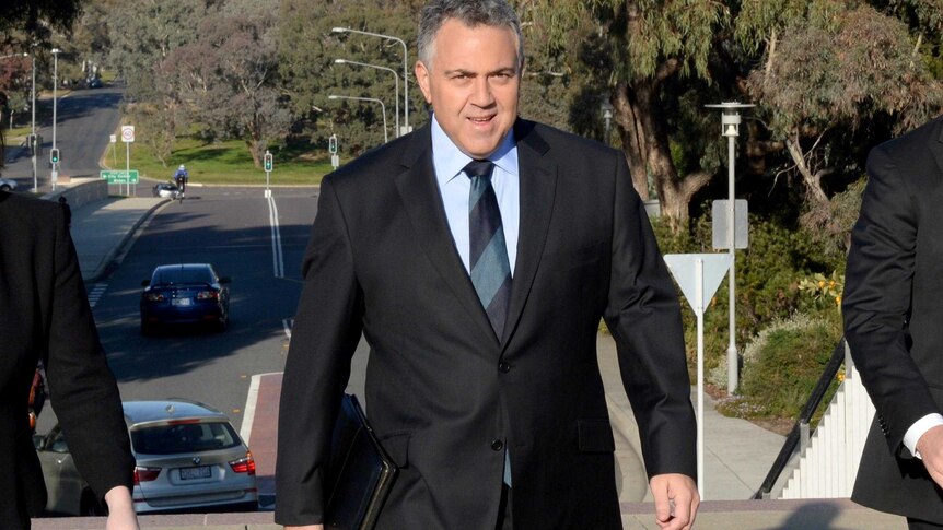 Treasurer Joe Hockey arrives at Parliament House, Canberra.