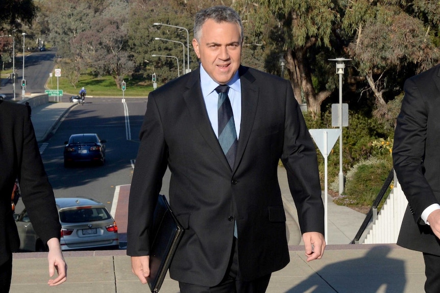 Treasurer Joe Hockey arrives at Parliament House, Canberra.