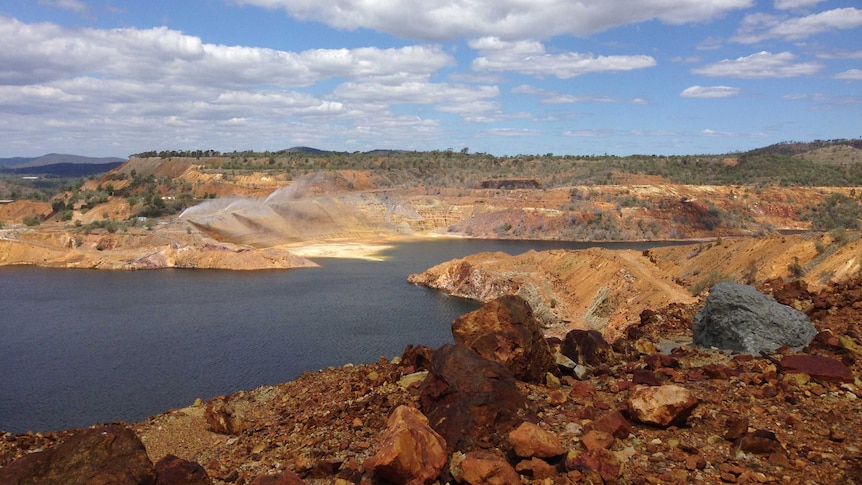 The main pit at the old Mount Morgan mine which is now filled with contaminated water.