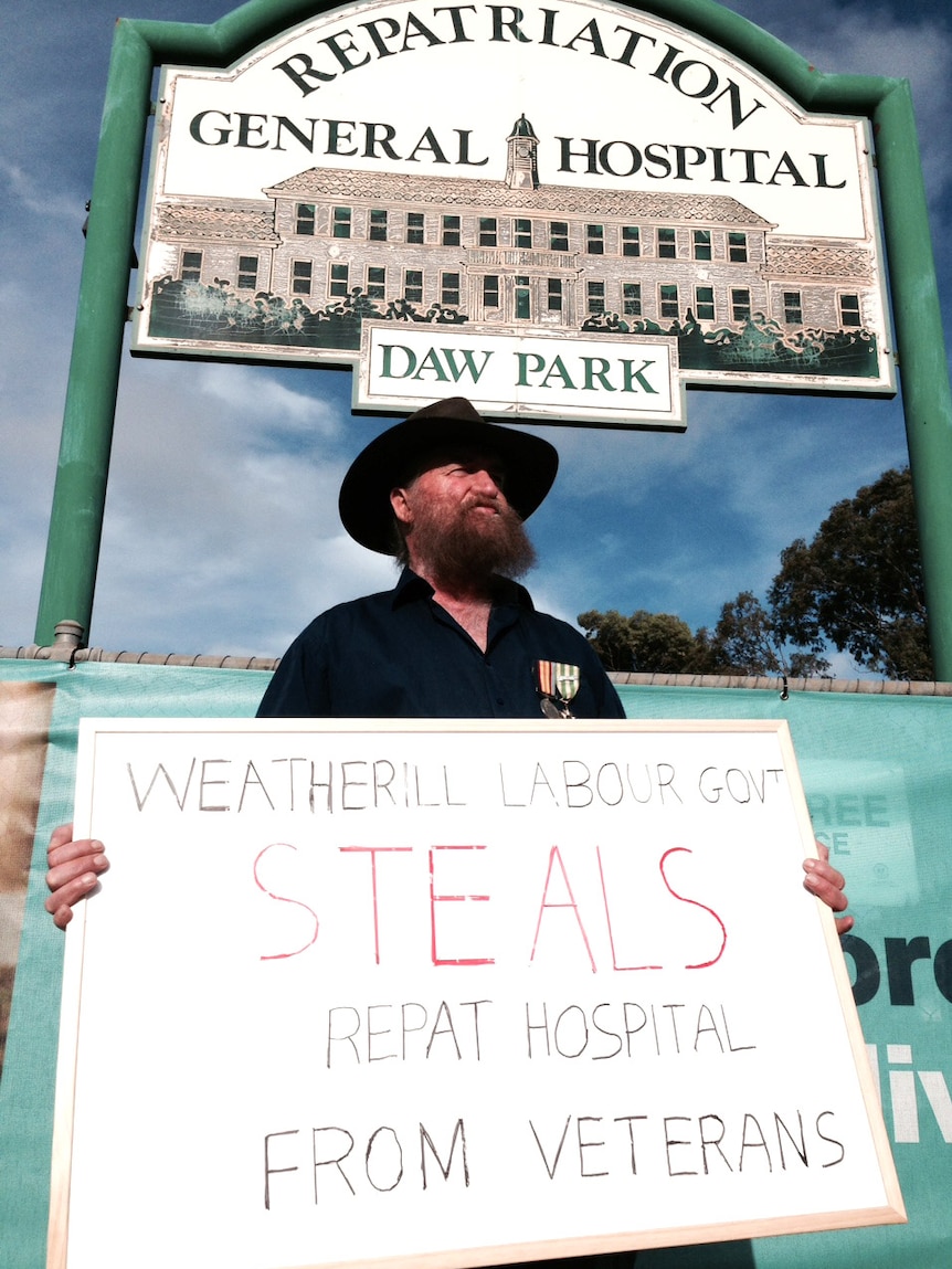 Retired serviceman Jock McGowan protests against the Weatherill Government's health changes