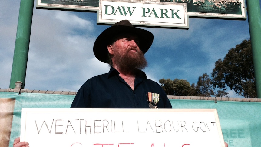 Retired serviceman Jock McGowan protests against the Weatherill Government's health changes