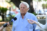 Ken Fleming talking to press in Darwin.