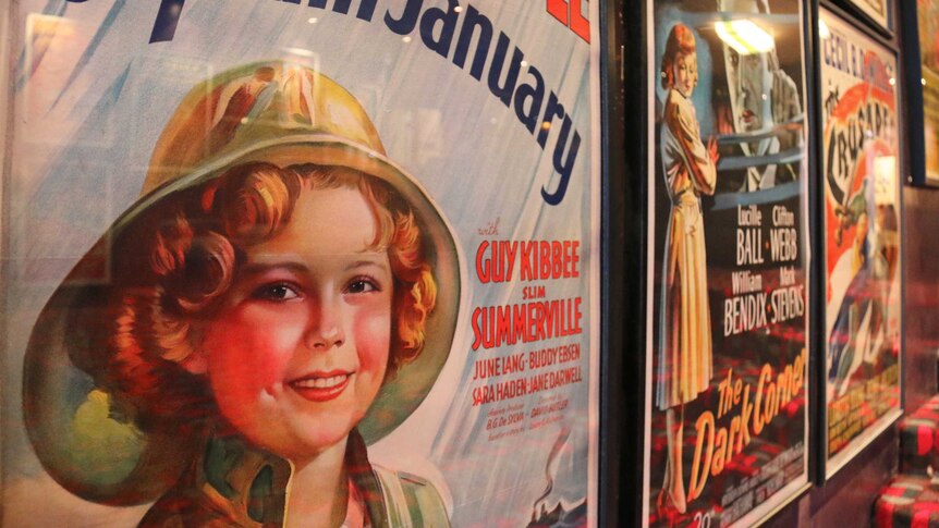 A movie poster featuring Shirley Temple.