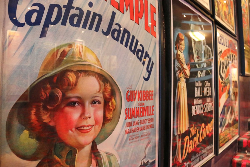 A movie poster featuring Shirley Temple.