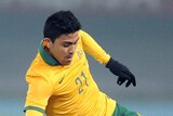 Massimo Luongo of the Socceroos is tackled