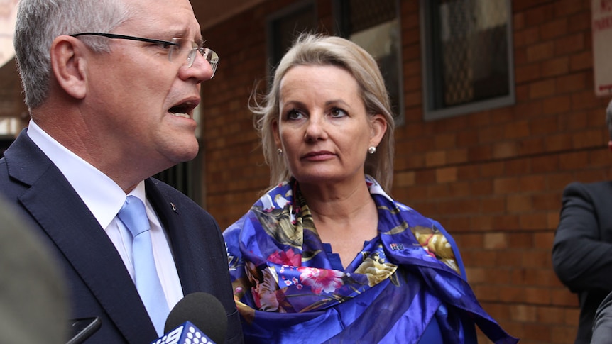 Liberal frontbencher Sussan Ley, on right, listens to Prime Minister Scott Morrison talk.