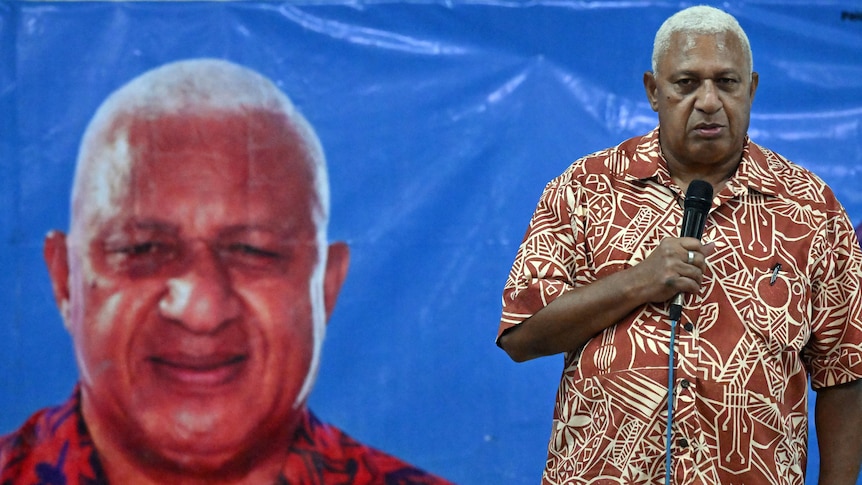 A Fijian man in a Bula shirt.