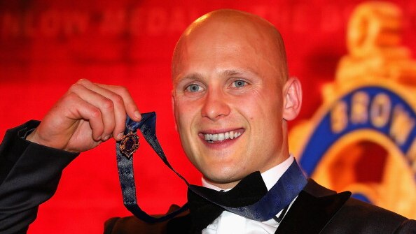 The Suns' Gary Ablett poses with the medal after winning the 2013 Brownlow Medal.
