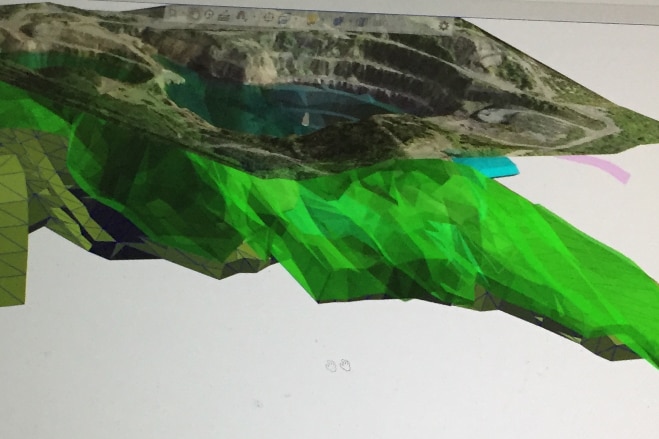 Computer graphic displays the copper drill results as a whale shaped green blob beneath the old open pit mine at Mount Chalmers.