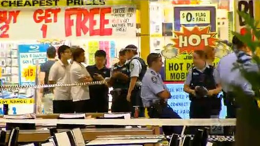 Police cordon off an area of the food court at Westfield Parramatta.