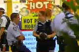 Police cordon off an area of the food court at Westfield Parramatta.